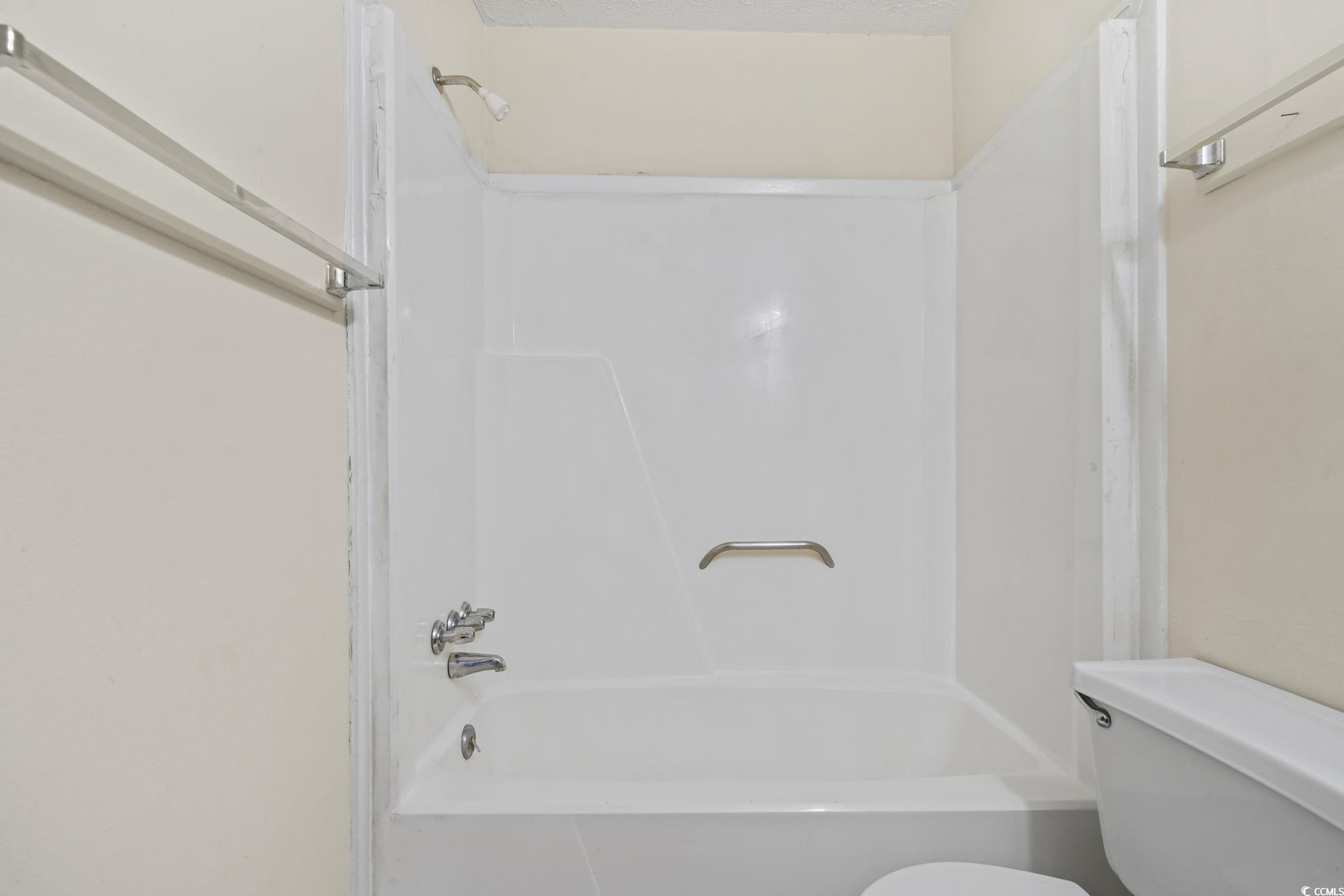 615 Carter Lane, Unit A1 Conway, SC 29526 - Photo 23 of 31 Bathroom with washtub / shower combination and toilet