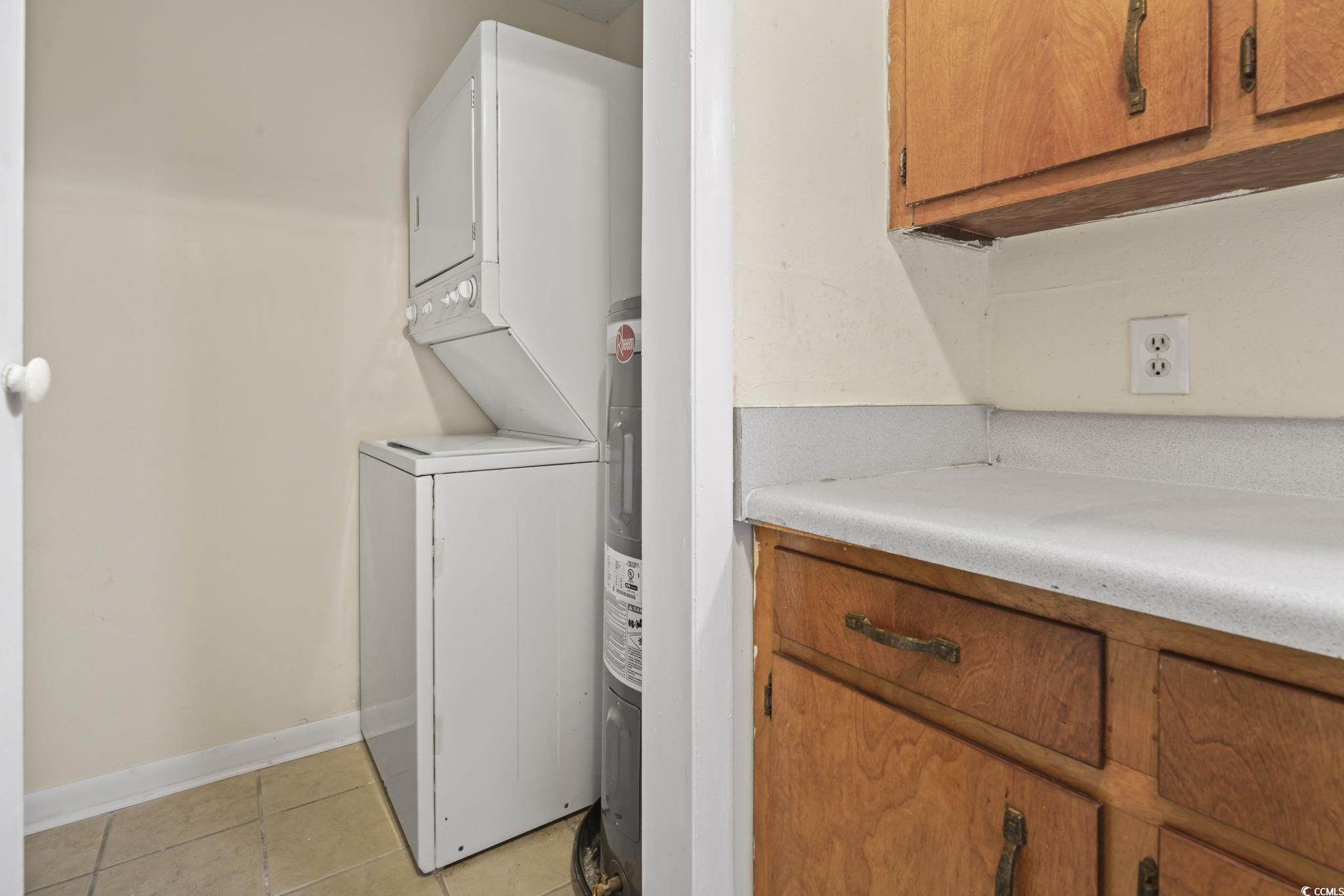 615 Carter Lane, Unit A1 Conway, SC 29526 - Photo 27 of 31 Washroom featuring light tile patterned floors and stacked washer / drying machine