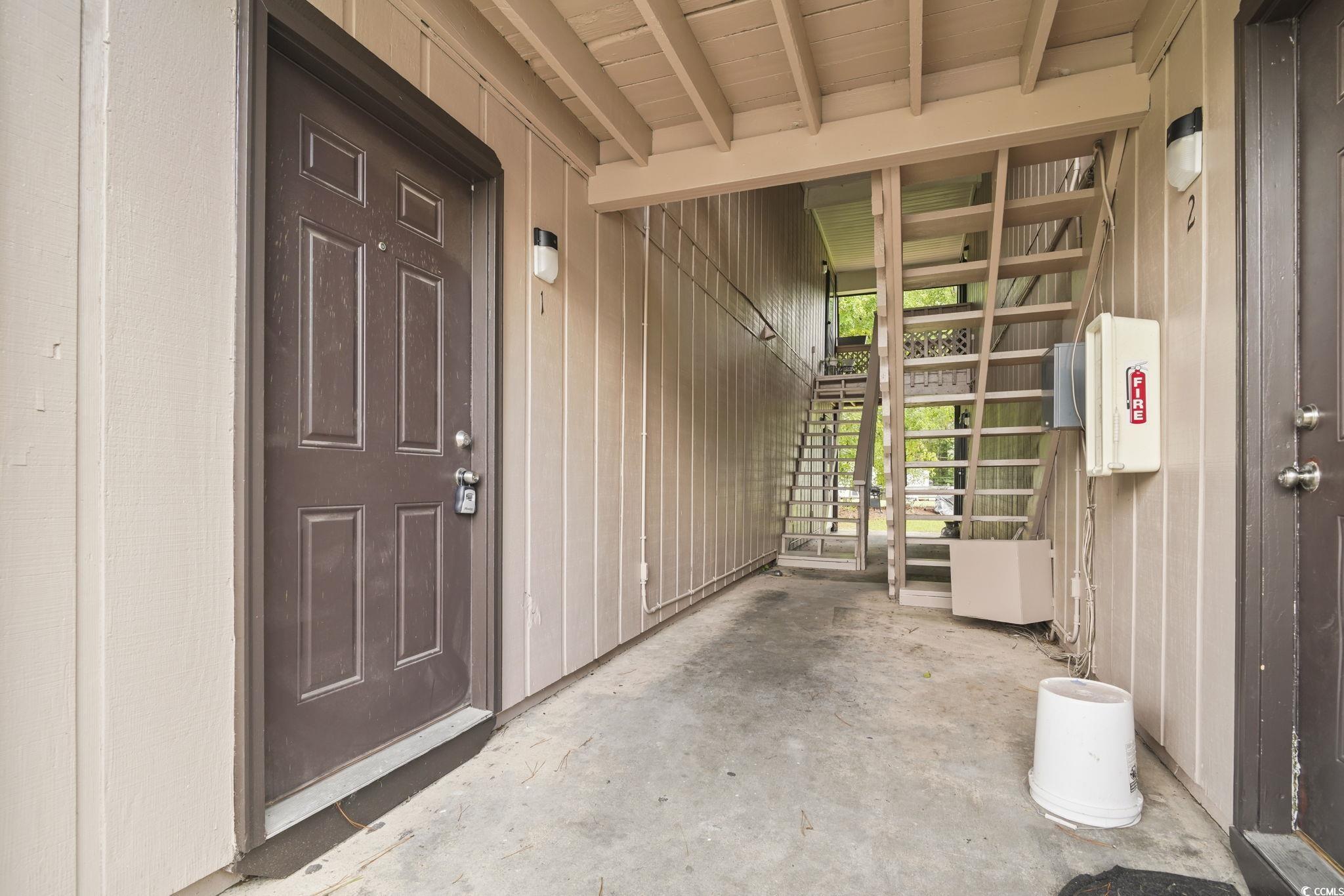 615 Carter Lane, Unit A1 Conway, SC 29526 - Photo 29 of 31 View of exterior entry featuring covered porch