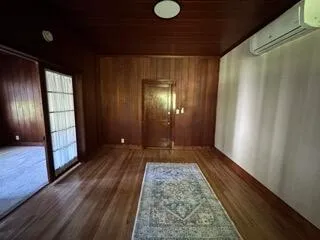 a view of gallery with wooden floor