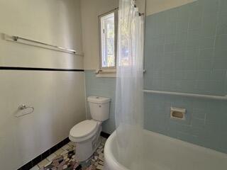 311 Pershing Way, Unit 2 West Palm Beach, FL 33401 - Photo 7 of 9 a bathroom with a toilet and a shower