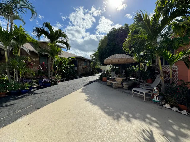 a view of a backyard with a patio area and furniture