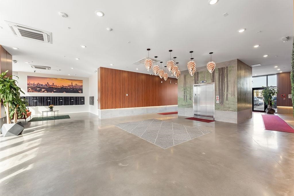 1 Flagship Street, Unit 208 Bayonne, NJ 07002 - Photo 19 of 32 a view of a kitchen with a refrigerator and a counter top space