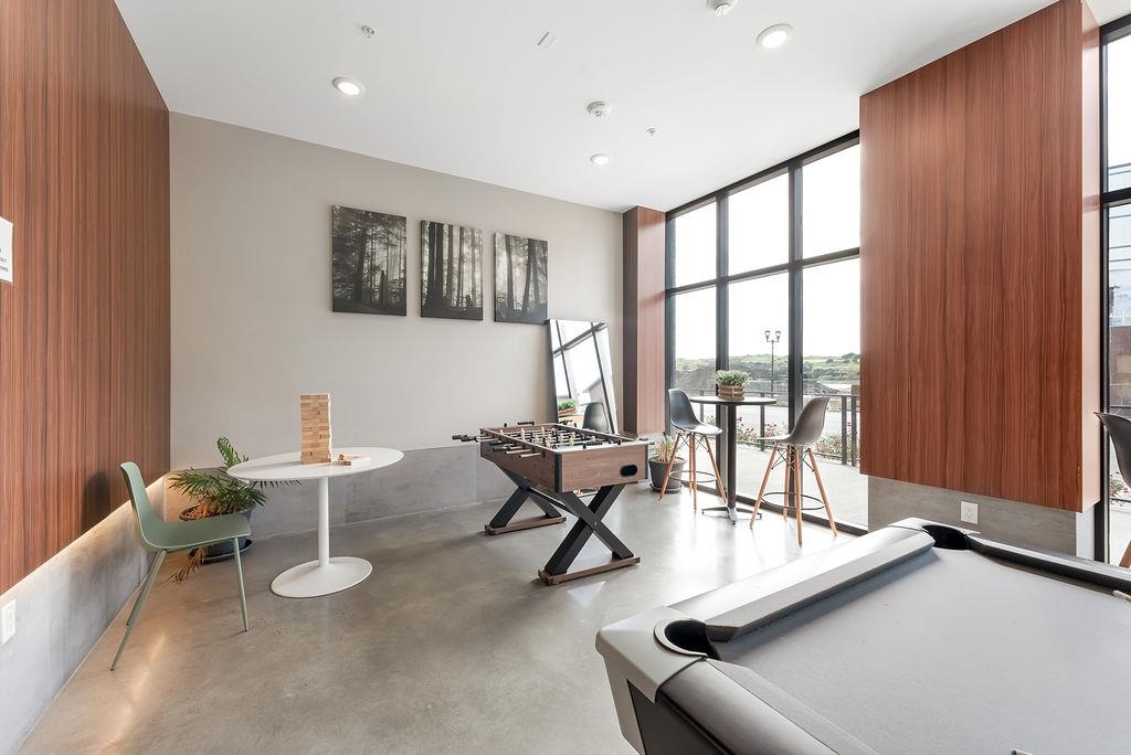 1 Flagship Street, Unit 208 Bayonne, NJ 07002 - Photo 22 of 32 a room with furniture and large windows