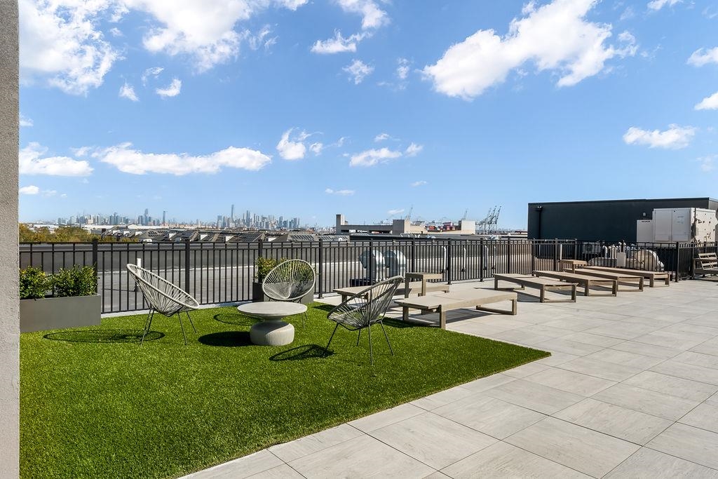 1 Flagship Street, Unit 208 Bayonne, NJ 07002 - Photo 30 of 32 a view of a garden and patio