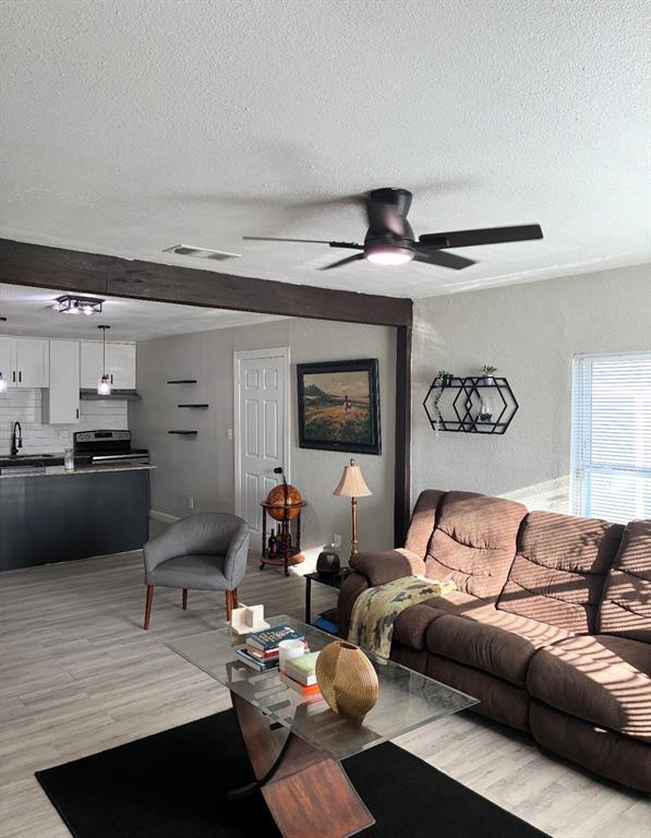 109 Lydia Street Terrell, TX 75160 - Photo 10 of 15 a living room with furniture and a wooden floor