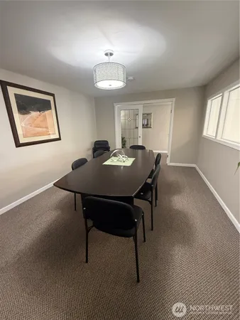 a view of a workspace with furniture
