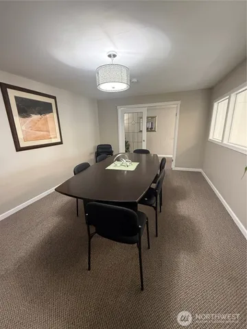 a view of a workspace with furniture