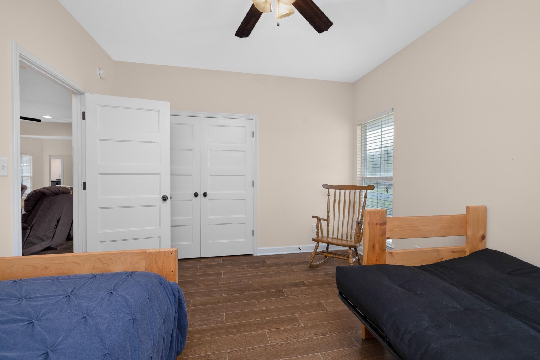 504 Bankston Road Nesbit, MS 38651 - Photo 24 of 39 Interior room featuring wood-finish flooring, a ceiling fan, and a window with horizontal blinds