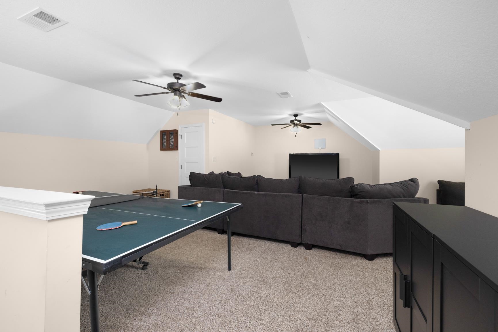 504 Bankston Road Nesbit, MS 38651 - Photo 27 of 39 Spacious bonus room featuring vaulted ceilings, recessed lighting, and soft carpet flooring