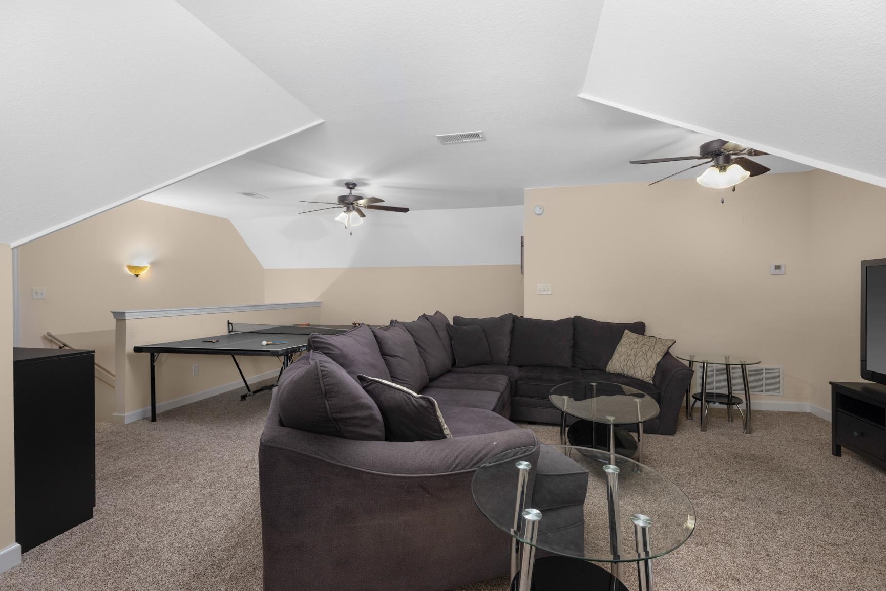 504 Bankston Road Nesbit, MS 38651 - Photo 28 of 39 Spacious bonus room featuring sloped ceilings, carpet flooring, and neutral wall tones