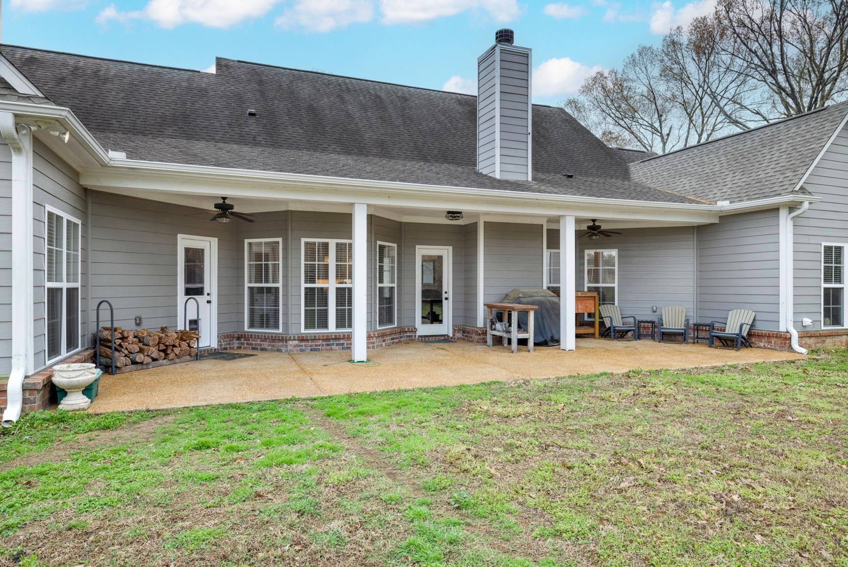 504 Bankston Road Nesbit, MS 38651 - Photo 31 of 39 Expansive concrete patio with a covered porch featuring multiple access points to the interior