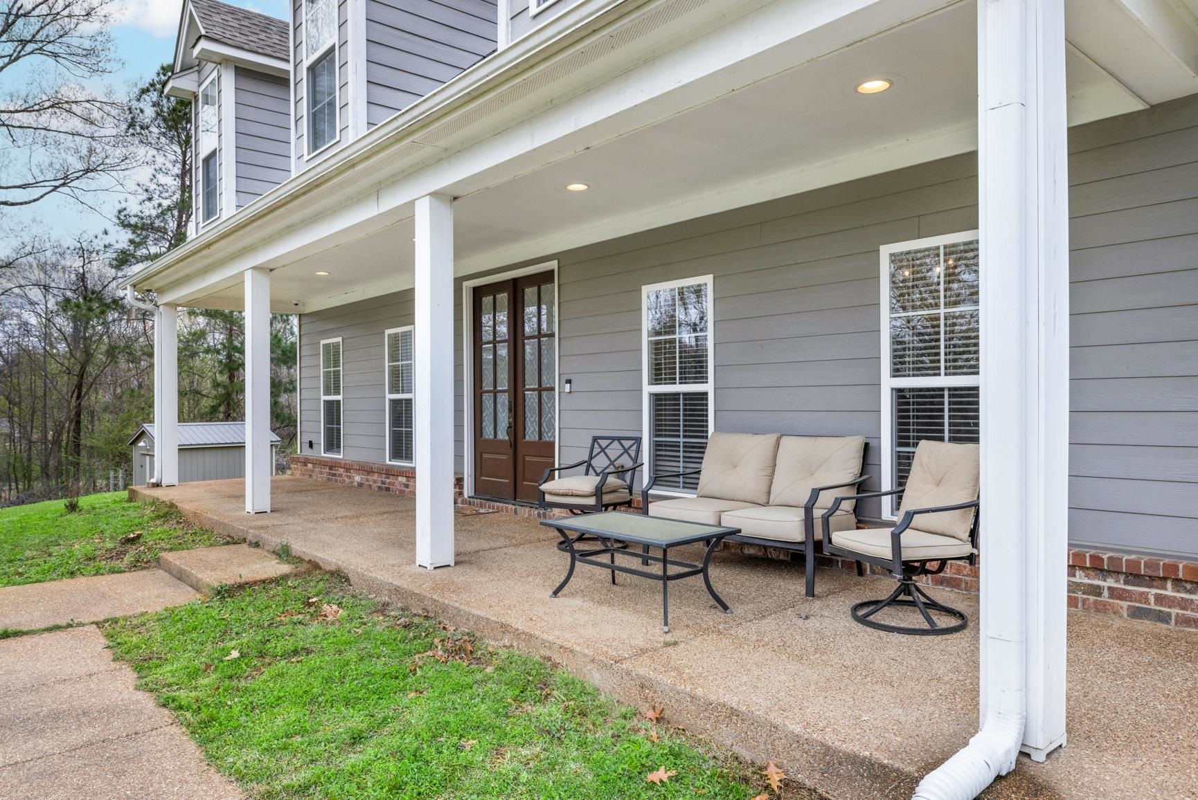 504 Bankston Road Nesbit, MS 38651 - Photo 5 of 39 Columned front porch featuring a dark wood double-door entry