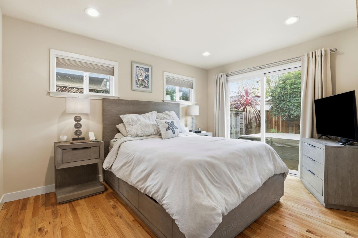 4570 Jewel Street Capitola, CA 95010 - Photo 15 of 45 a bedroom with a bed and a flat screen tv