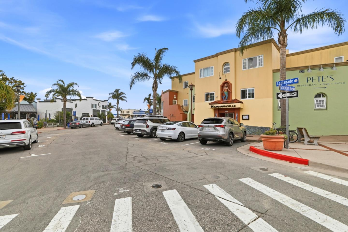 4570 Jewel Street Capitola, CA 95010 - Photo 40 of 45 a view of road with card parked on side and retail shops