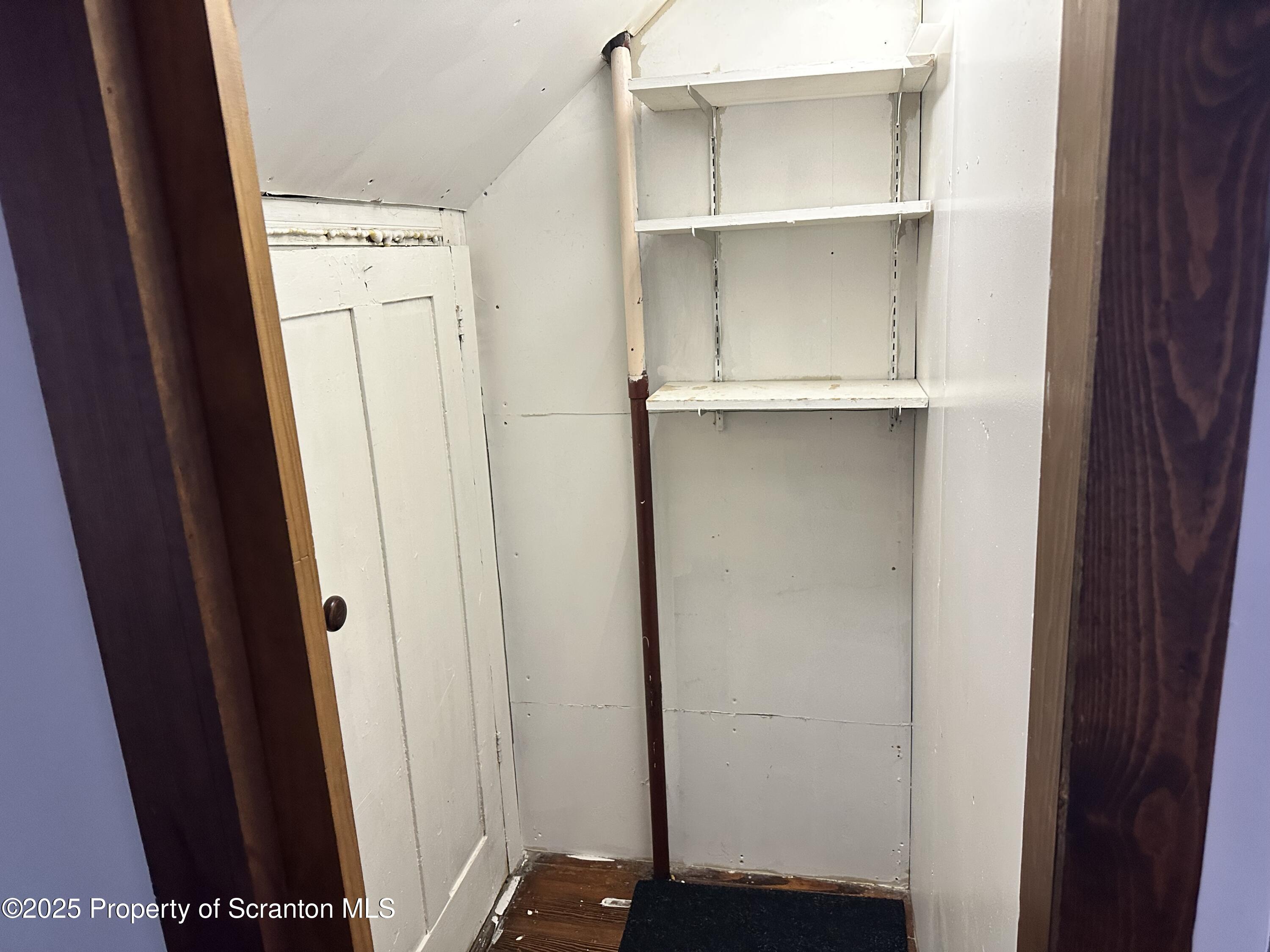 1108 North Abington Road Waverly, PA 18471 - Photo 19 of 32 a view of walk in closet with empty racks