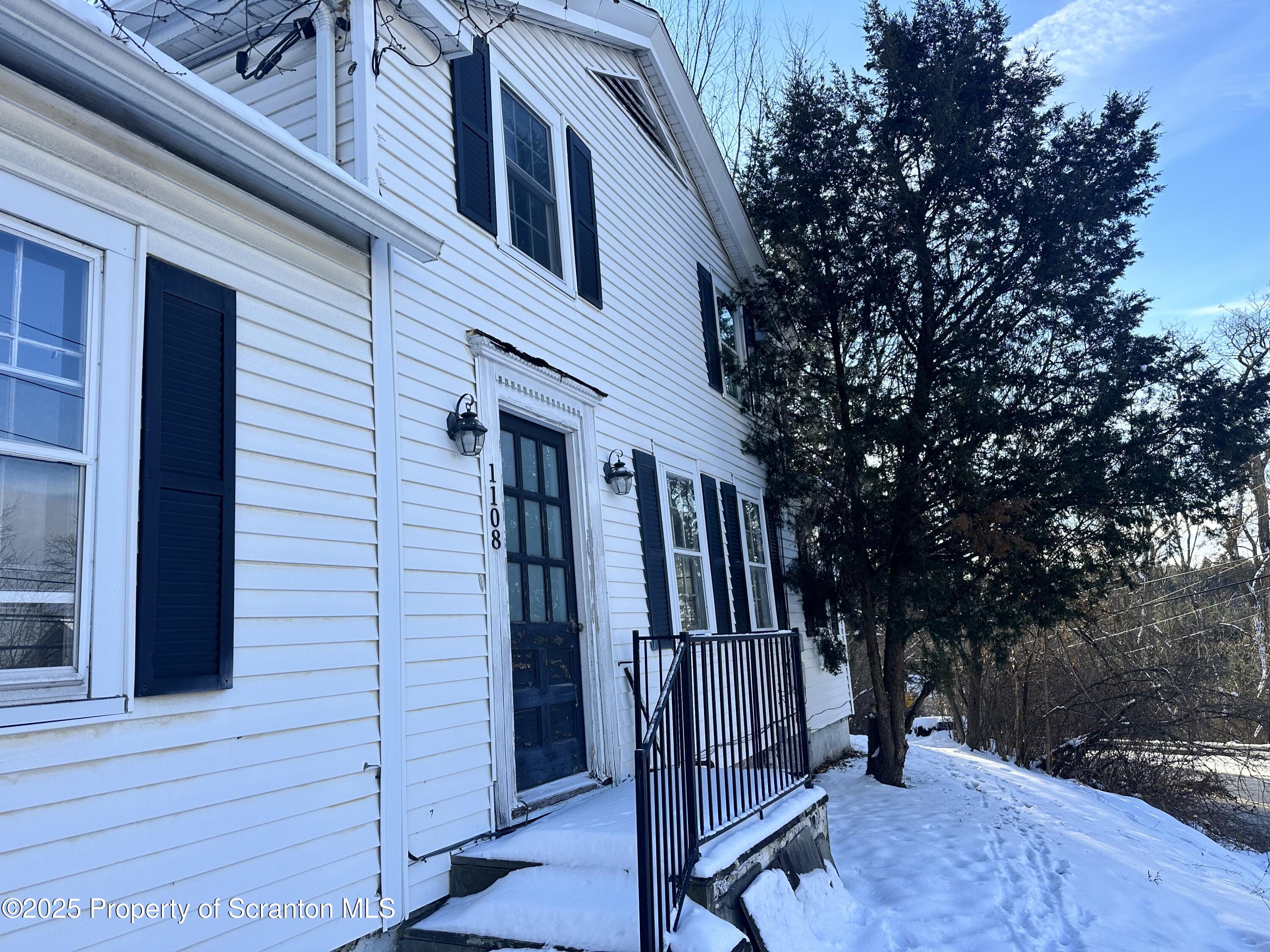 1108 North Abington Road Waverly, PA 18471 - Photo 2 of 32 a view of a house with a deck