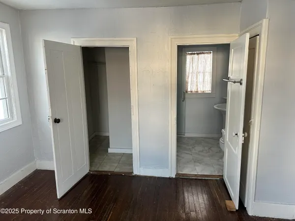 a view of entryway with wooden floor and stairs