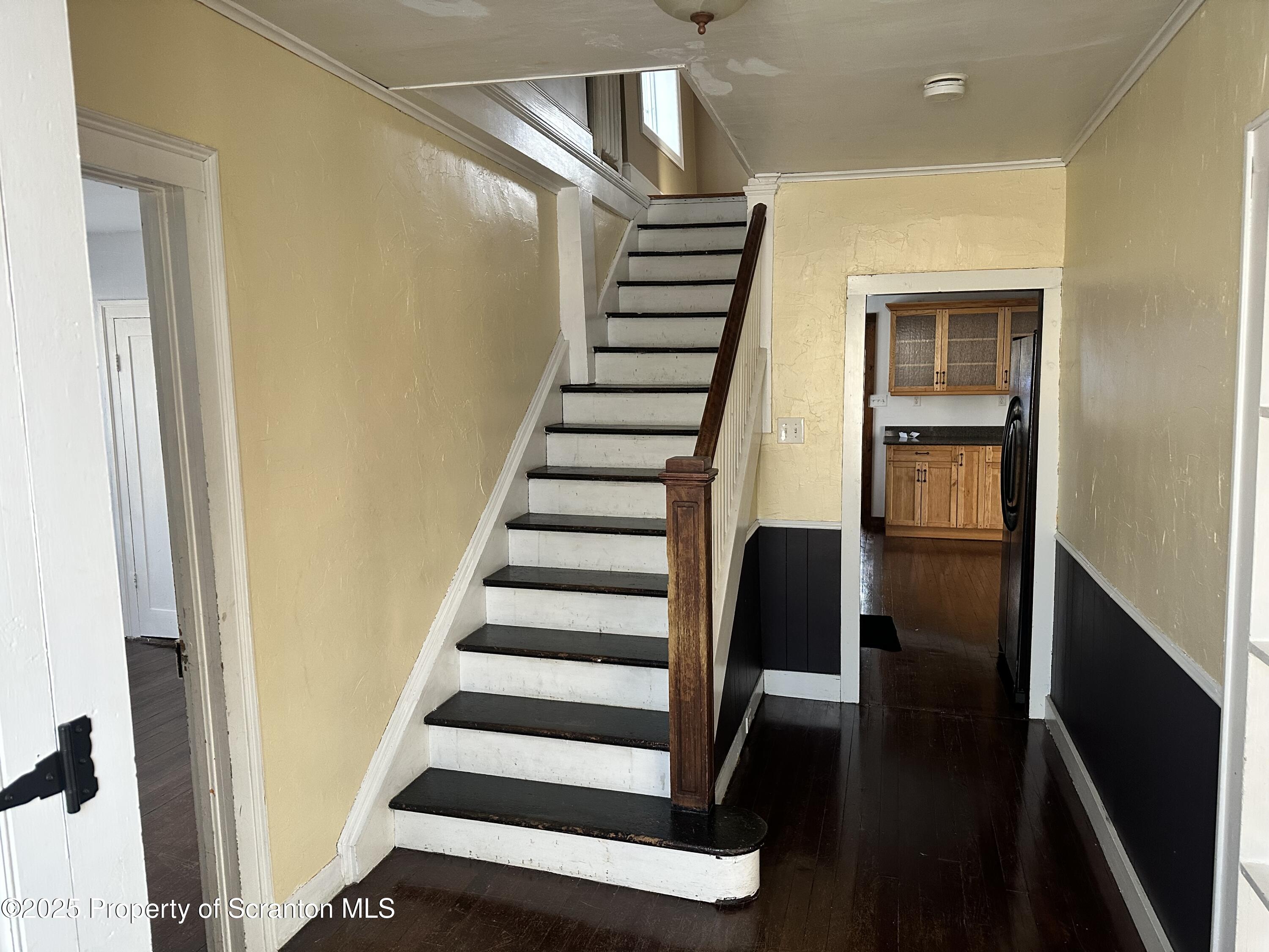 1108 North Abington Road Waverly, PA 18471 - Photo 23 of 32 a view of entryway with wooden floor and stairs