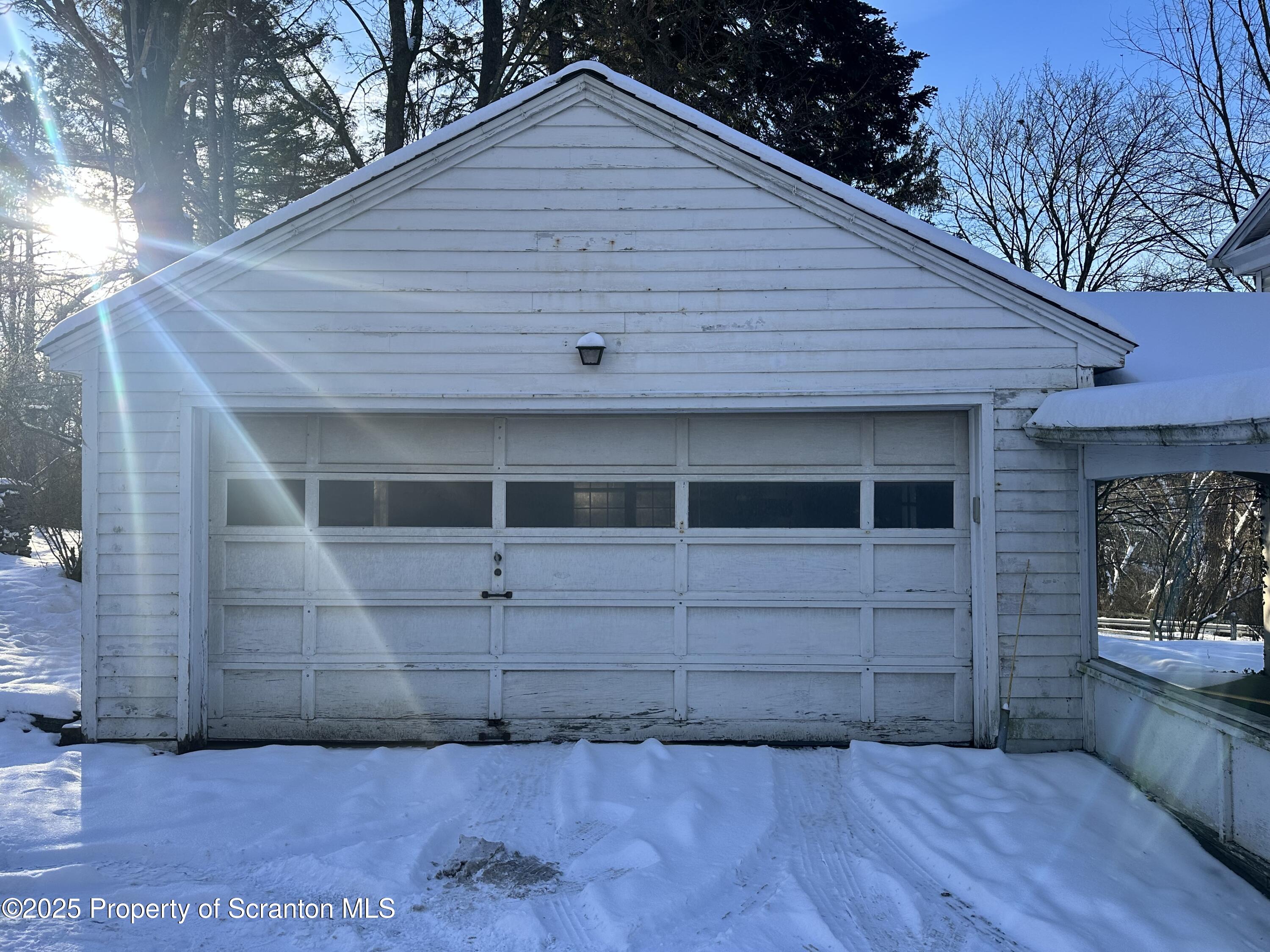 1108 North Abington Road Waverly, PA 18471 - Photo 5 of 32 a front view of a house with a yard