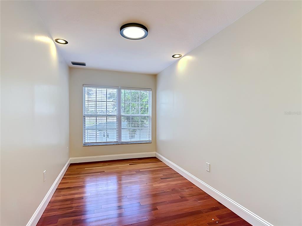 7925 Lake Mabel Loop Road Lake Wales, FL 33898 - Photo 46 of 97 a view of an empty room with wooden floor and a window