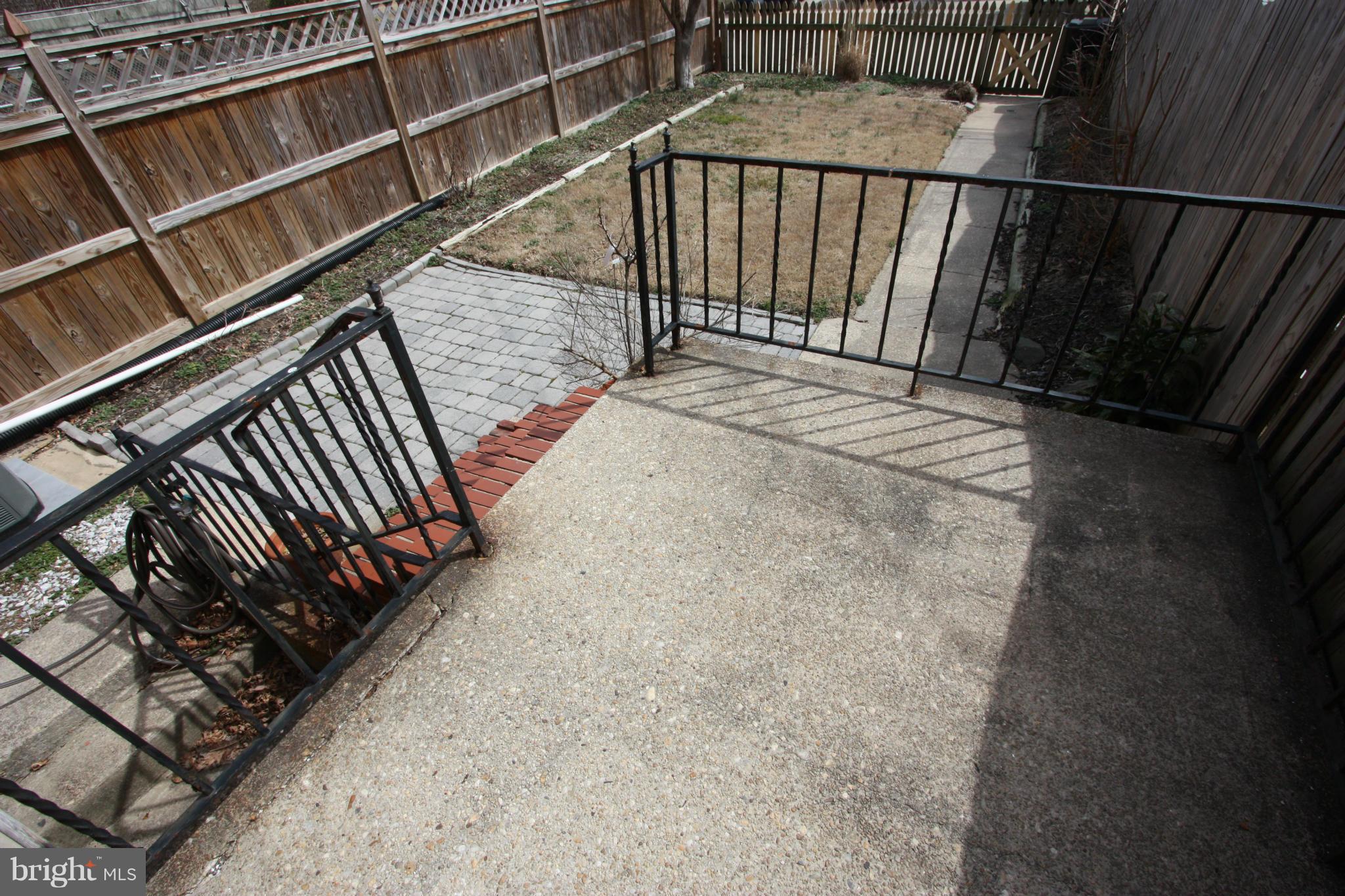 8135 Pleasant Plains Road Towson, MD 21286 - Photo 25 of 30 VIEW OF THE LARGE BACK YARD FROM THE BACK DOOR