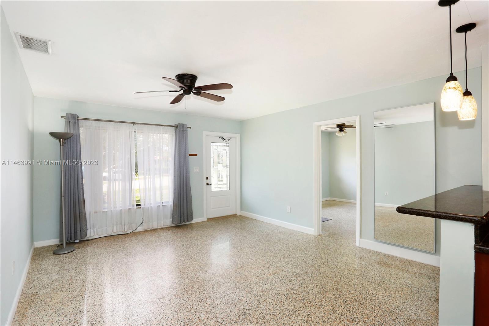 10045 Southwest 82nd Street Miami, FL 33173 - Photo 12 of 31 a view of an empty room with a ceiling fan and window