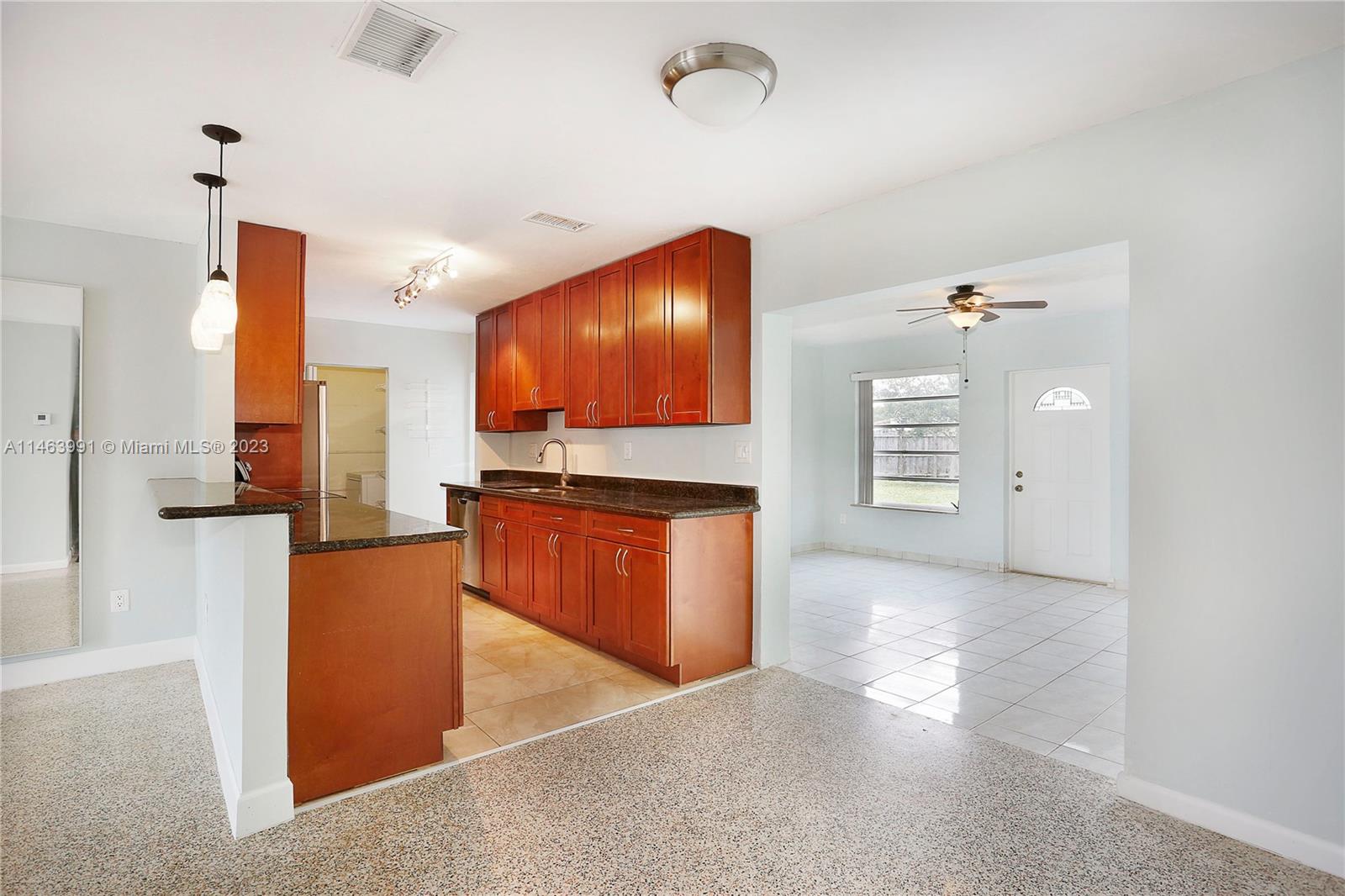 10045 Southwest 82nd Street Miami, FL 33173 - Photo 14 of 31 a view of kitchen with stainless steel appliances granite countertop cabinets and a counter top space