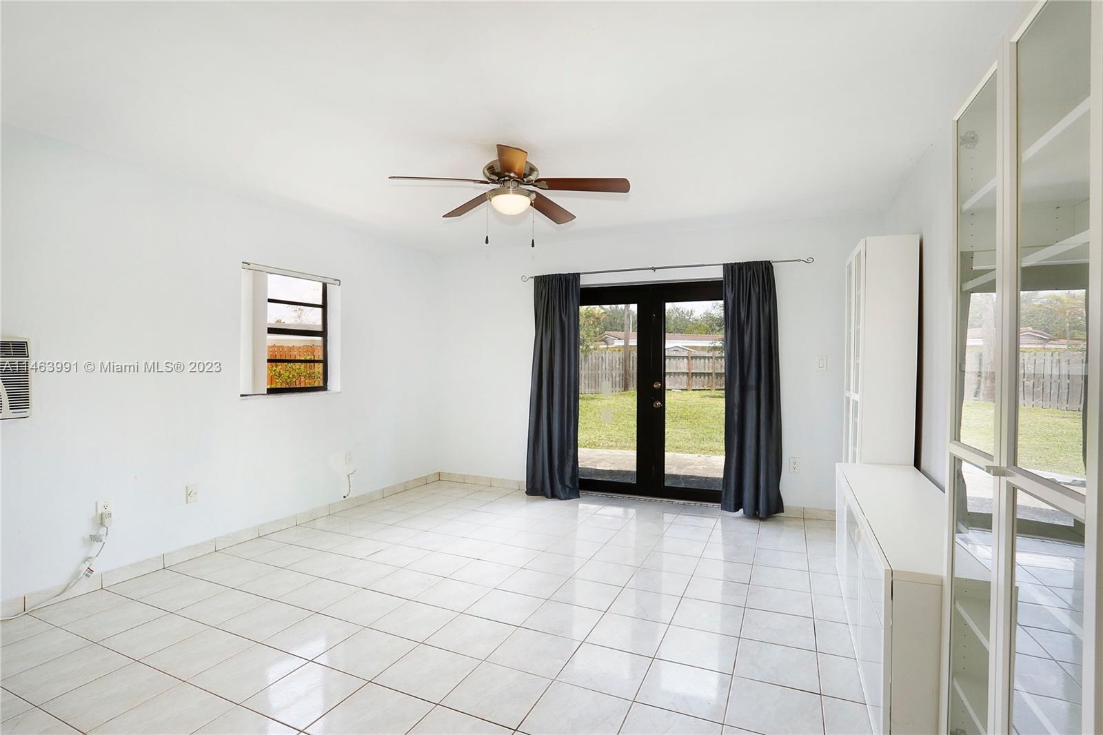 10045 Southwest 82nd Street Miami, FL 33173 - Photo 21 of 31 a view of an empty room with window
