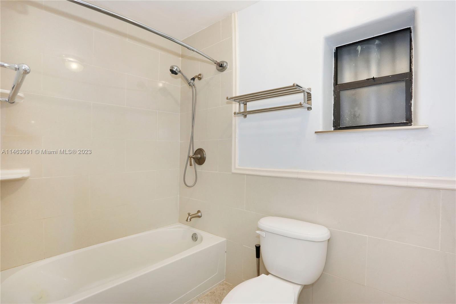 10045 Southwest 82nd Street Miami, FL 33173 - Photo 24 of 31 a bathroom with a toilet sink and shower