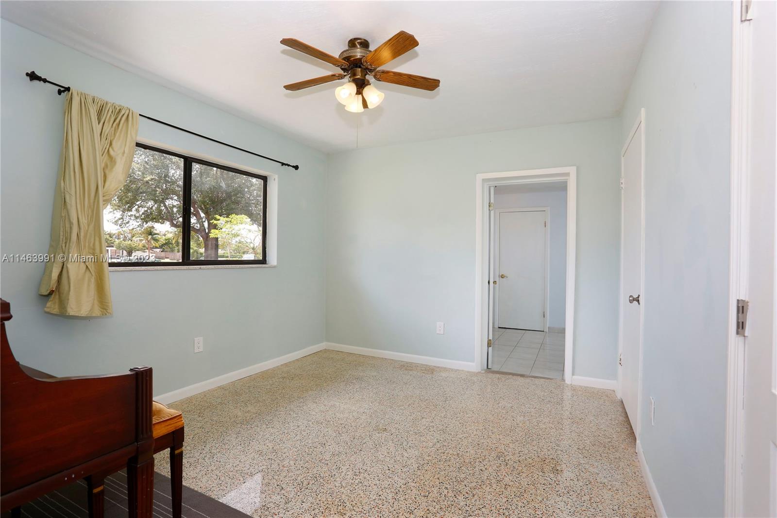 10045 Southwest 82nd Street Miami, FL 33173 - Photo 25 of 31 a view of a livingroom with a workspace