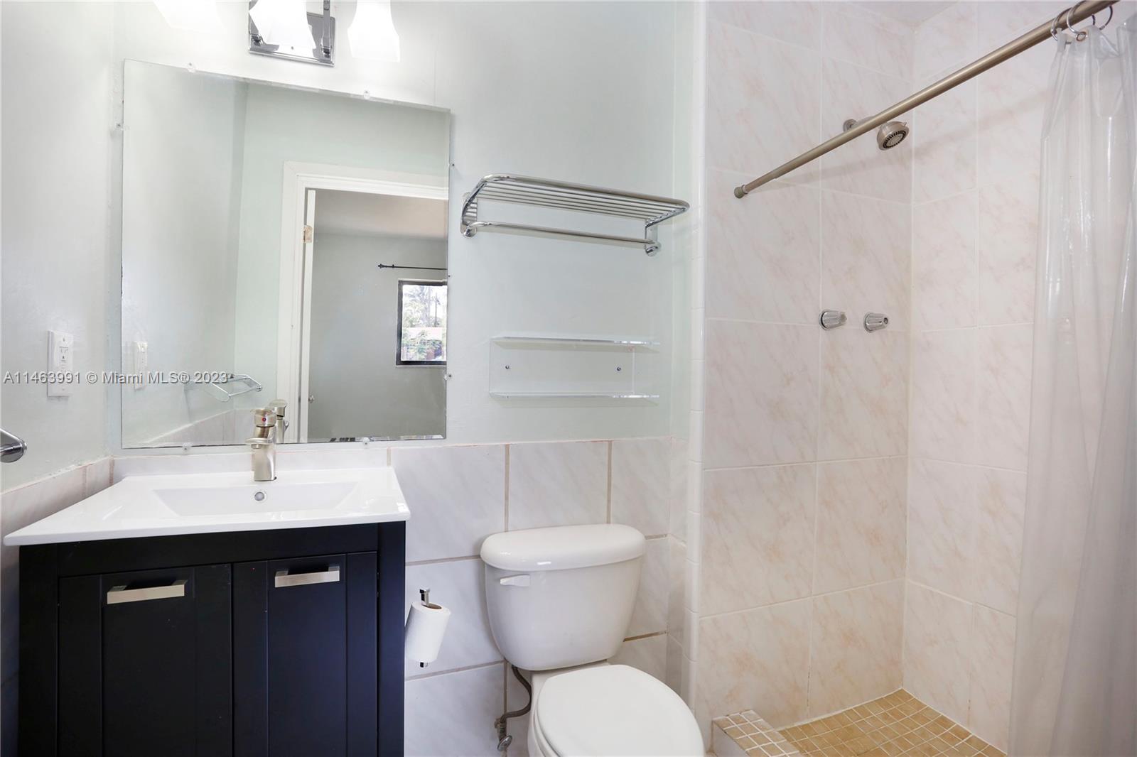 10045 Southwest 82nd Street Miami, FL 33173 - Photo 26 of 31 a bathroom with a sink toilet and shower