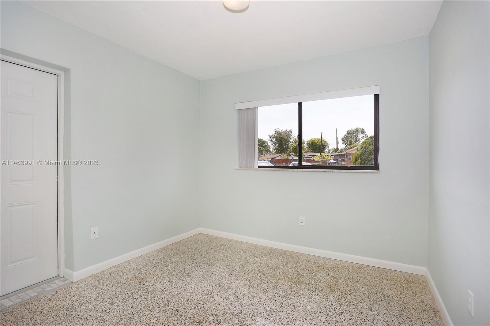 10045 Southwest 82nd Street Miami, FL 33173 - Photo 28 of 31 an empty room with a window