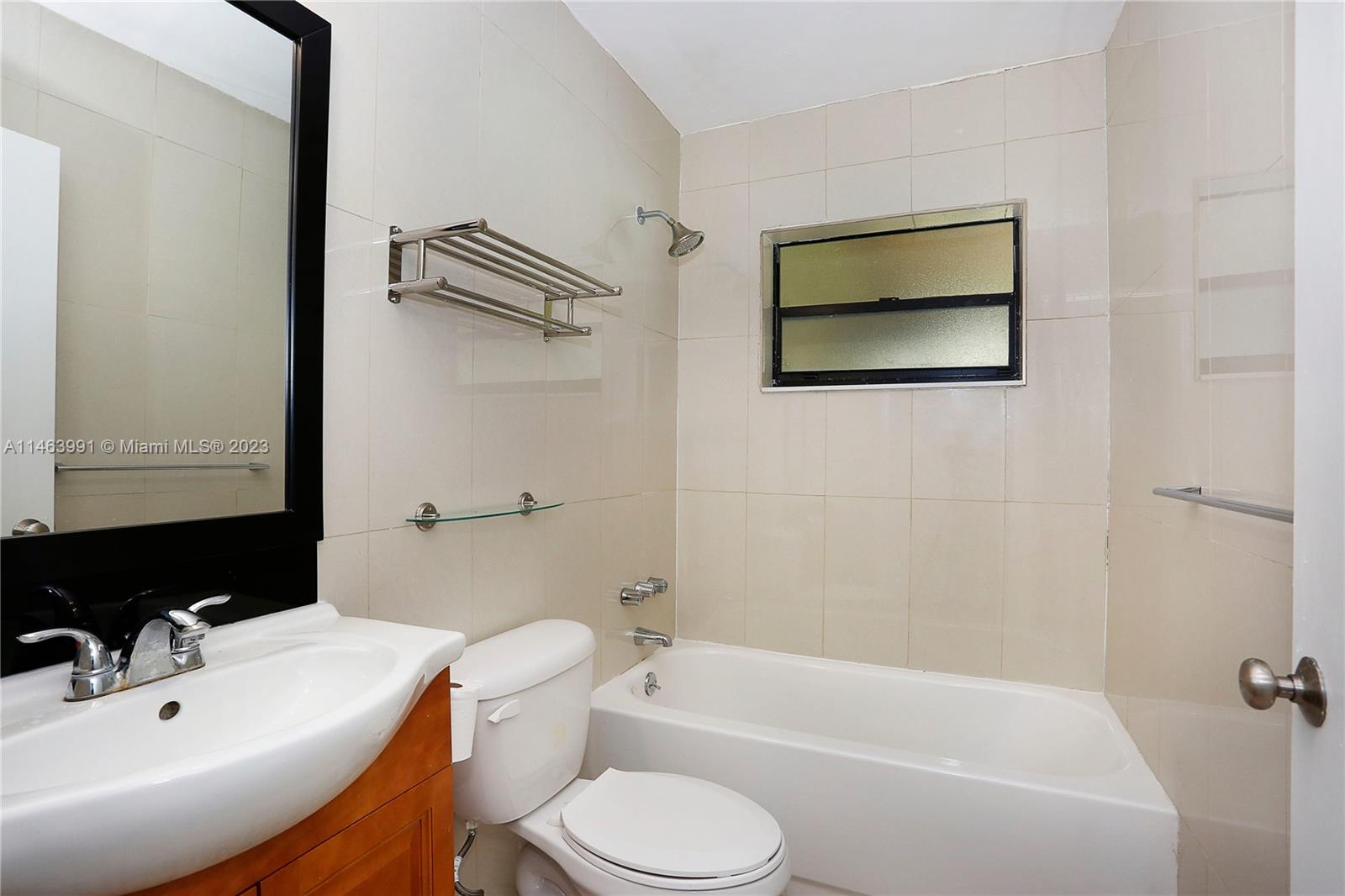 10045 Southwest 82nd Street Miami, FL 33173 - Photo 30 of 31 a bathroom with a toilet sink and bathtub