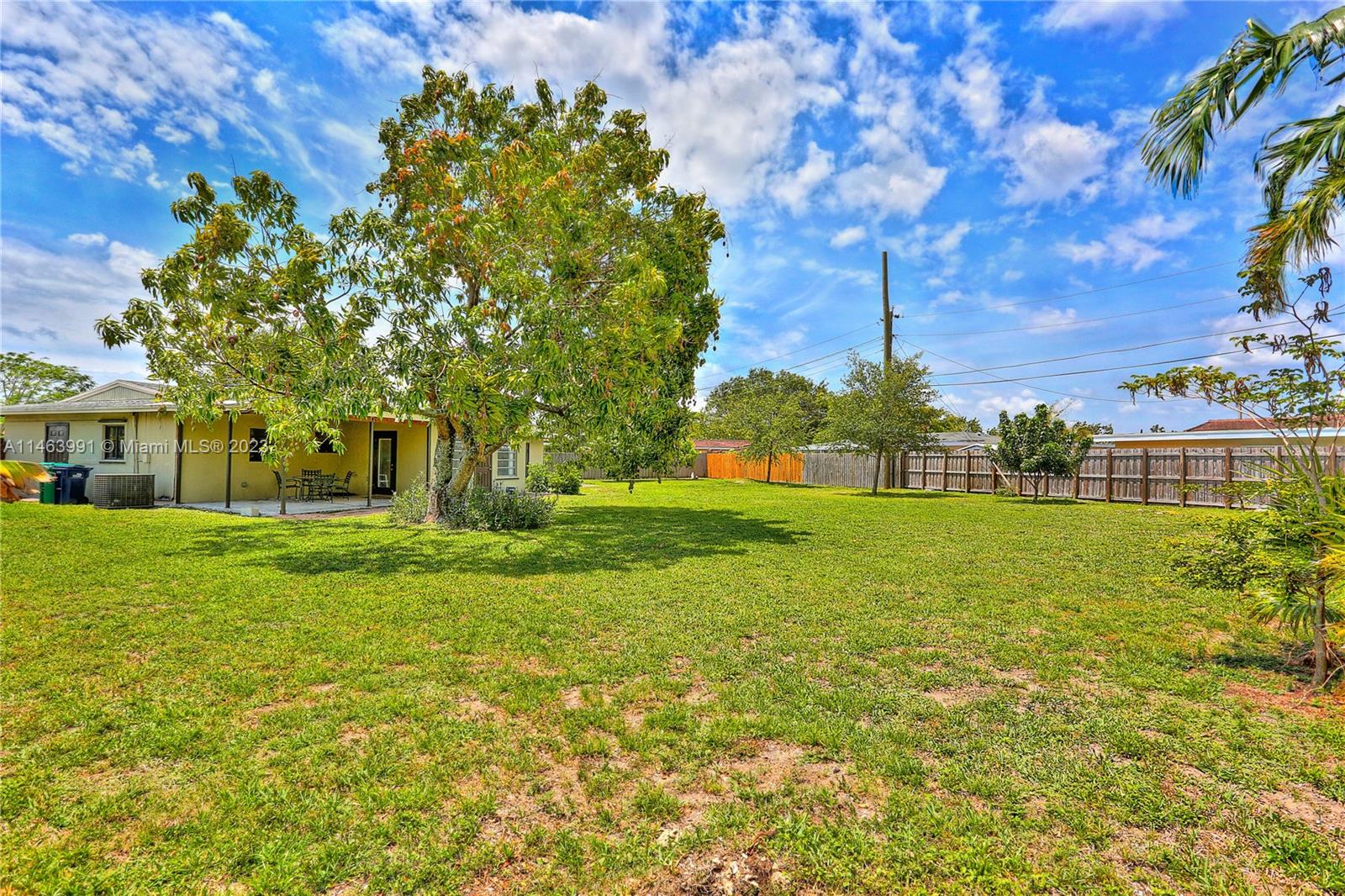 10045 Southwest 82nd Street Miami, FL 33173 - Photo 6 of 31 a front view of a house with a yard