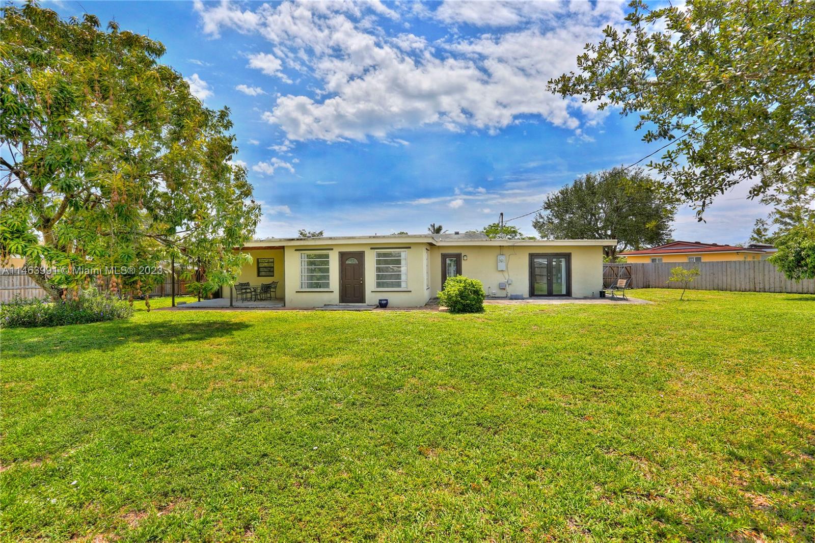 10045 Southwest 82nd Street Miami, FL 33173 - Photo 8 of 31 a front view of house with yard and green space