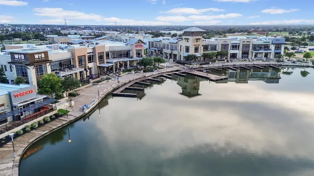 a view of a city that has lawn chairs