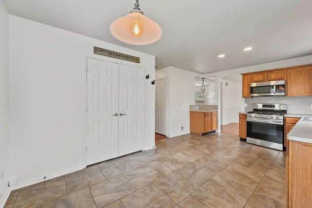 a view of kitchen with microwave and stove