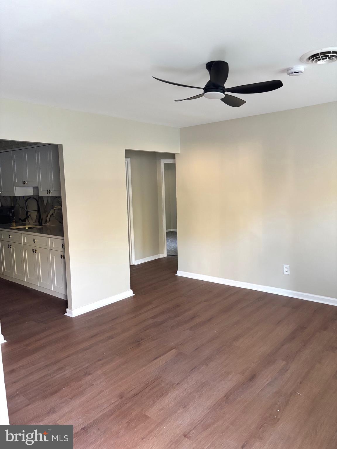 197 Kinsley Road Pemberton, NJ 08068 - Photo 2 of 6 a view of an empty room with wooden floor and a window