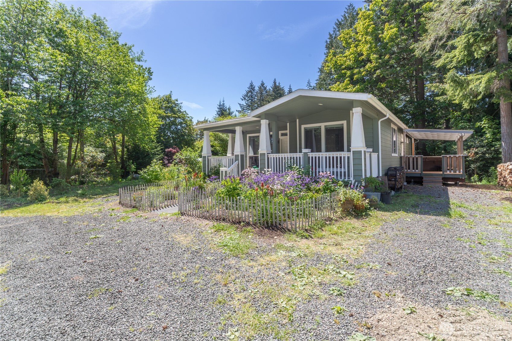 290 Werner Road Port Ludlow, WA 98365 - Photo 3 of 40 a front view of a house with garden