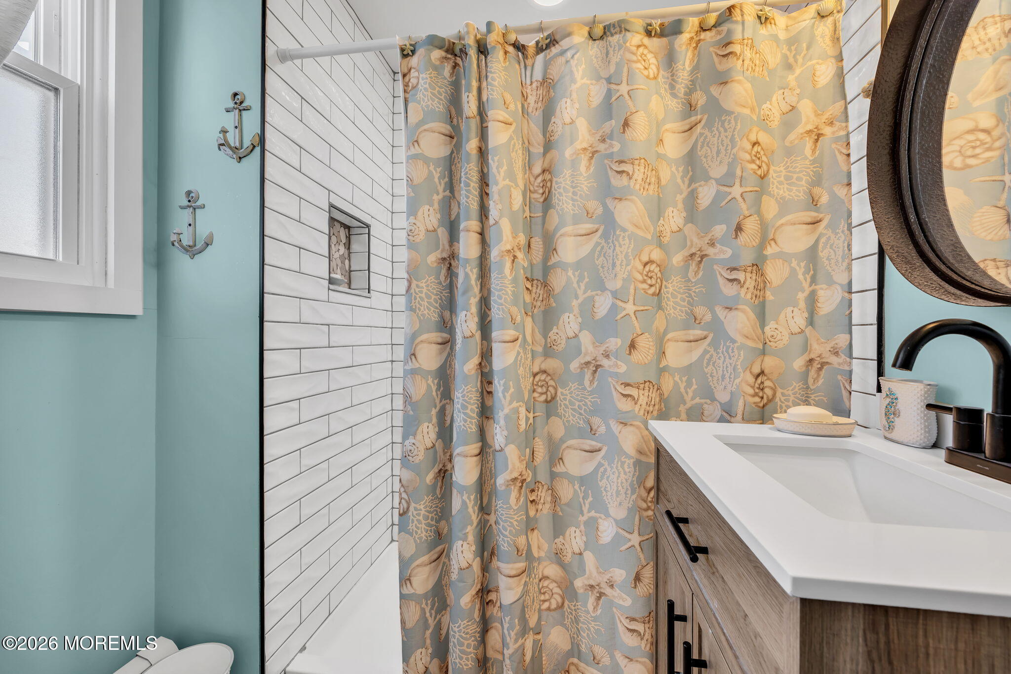 265 Thompson Avenue Middletown, NJ 07748 - Photo 15 of 35 a bathroom with a sink and a mirror