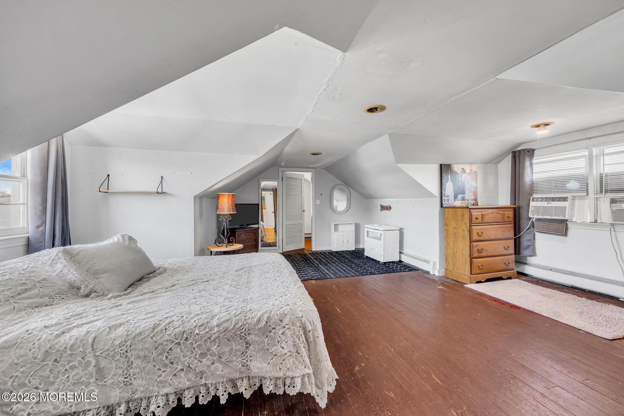 265 Thompson Avenue Middletown, NJ 07748 - Photo 27 of 35 a bedroom with a large bed and a flat tv screen on dresser