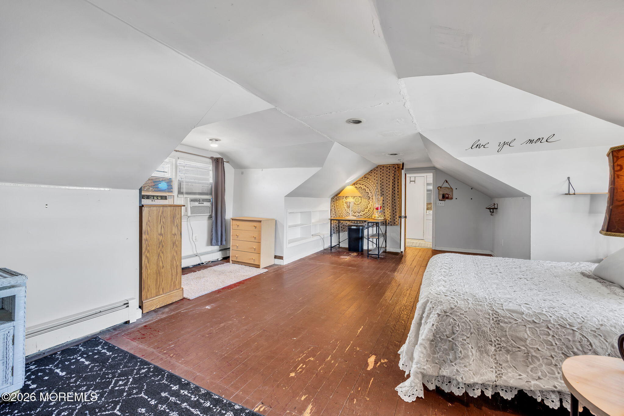 265 Thompson Avenue Middletown, NJ 07748 - Photo 28 of 35 a bedroom with a bed and wooden floor