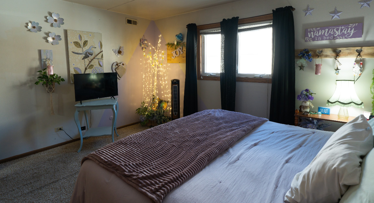 9140 South Pulaski Road, Unit 1W Oak Lawn, IL 60453 - Photo 12 of 17 a bedroom with a bed table closet and a flat tv screen