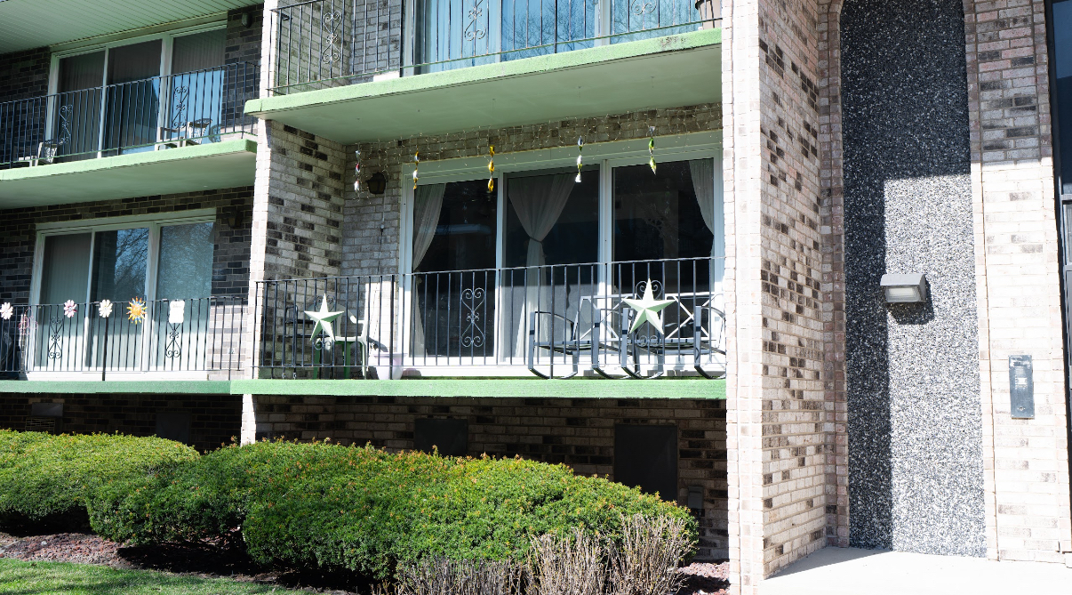 9140 South Pulaski Road, Unit 1W Oak Lawn, IL 60453 - Photo 17 of 17 a front view of a house with a yard balcony