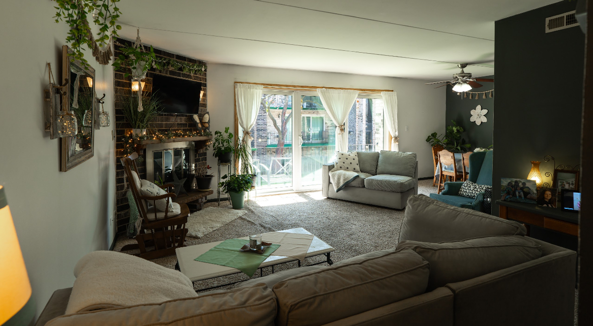 9140 South Pulaski Road, Unit 1W Oak Lawn, IL 60453 - Photo 3 of 17 a living room with furniture and a flat screen tv