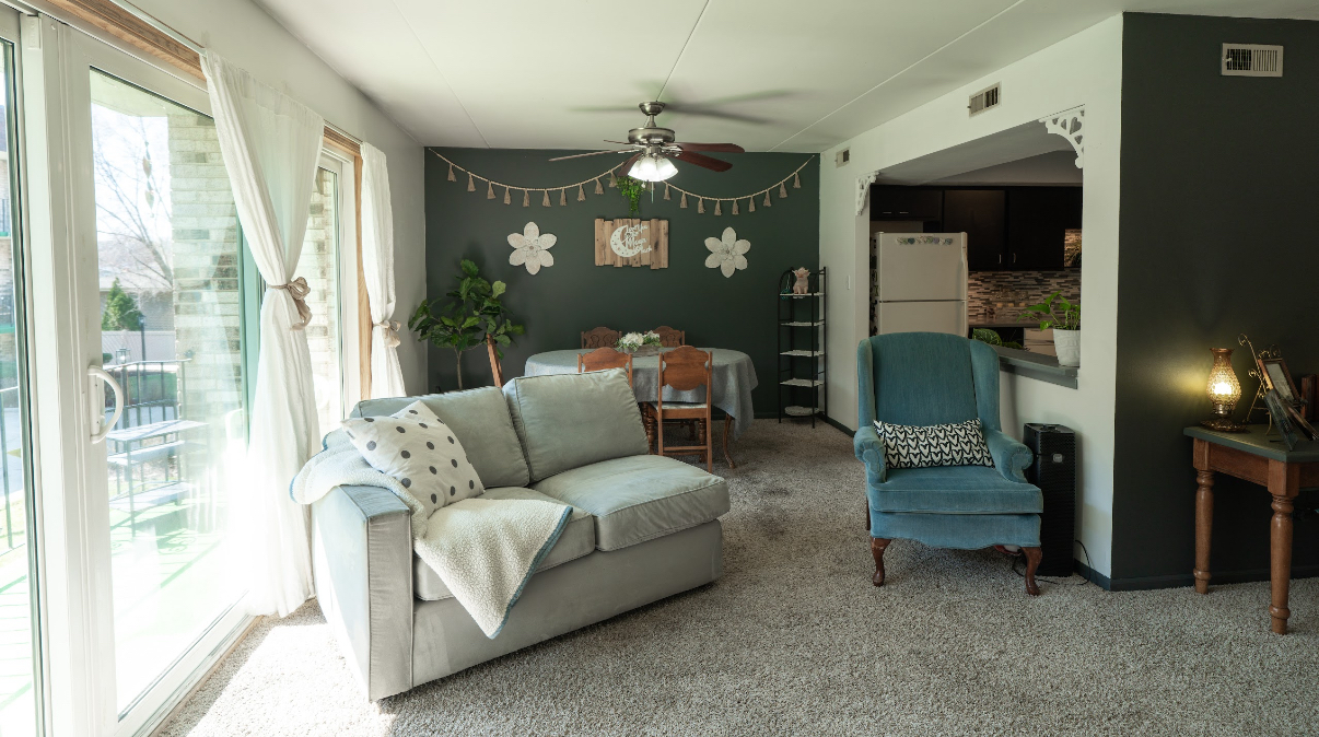 9140 South Pulaski Road, Unit 1W Oak Lawn, IL 60453 - Photo 5 of 17 a living room with furniture and a chandelier
