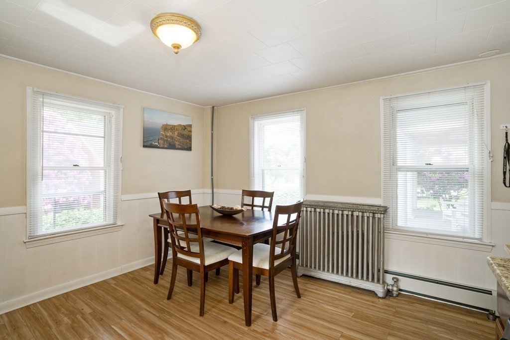 462-464 Gleasondale Road Stow, MA 01775 - Photo 10 of 36 a view of a dining room with furniture and wooden floor