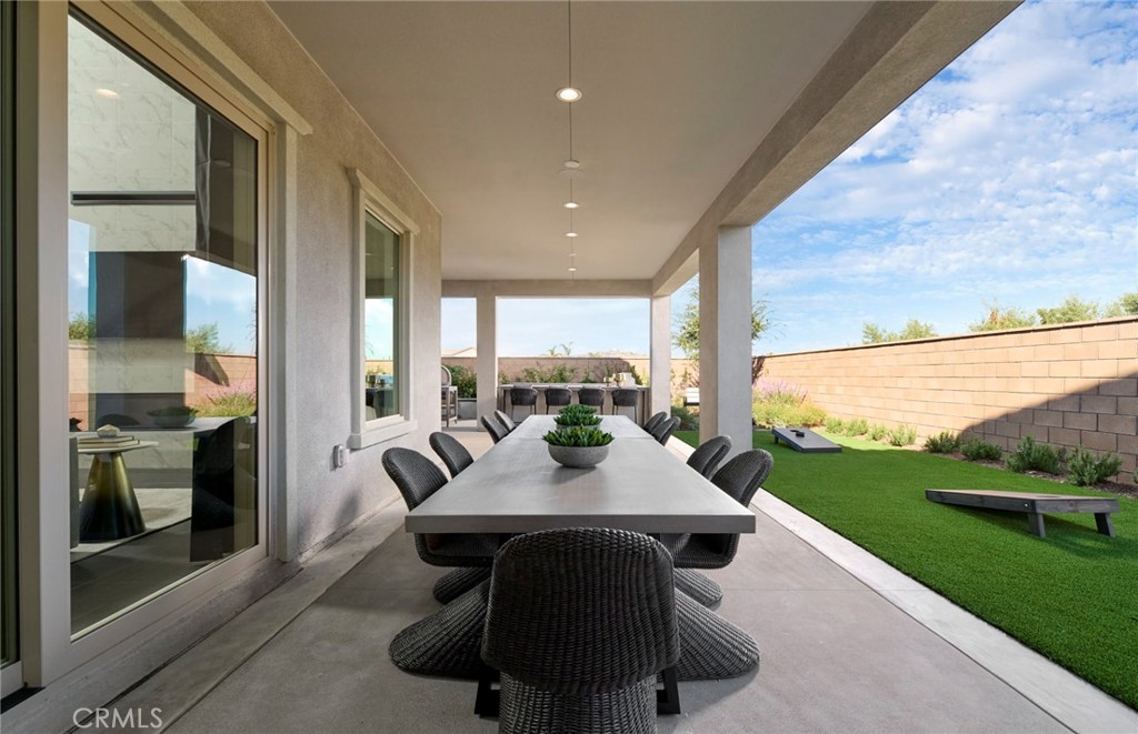 12828 Yountville Court Riverside, CA 92503 - Photo 2 of 11 a view of an outdoor dining space with furniture and garden