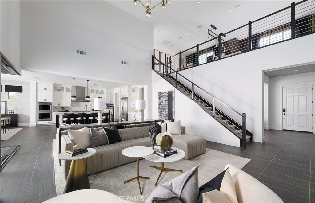 12828 Yountville Court Riverside, CA 92503 - Photo 5 of 11 a living room with furniture kitchen view and a wooden floor
